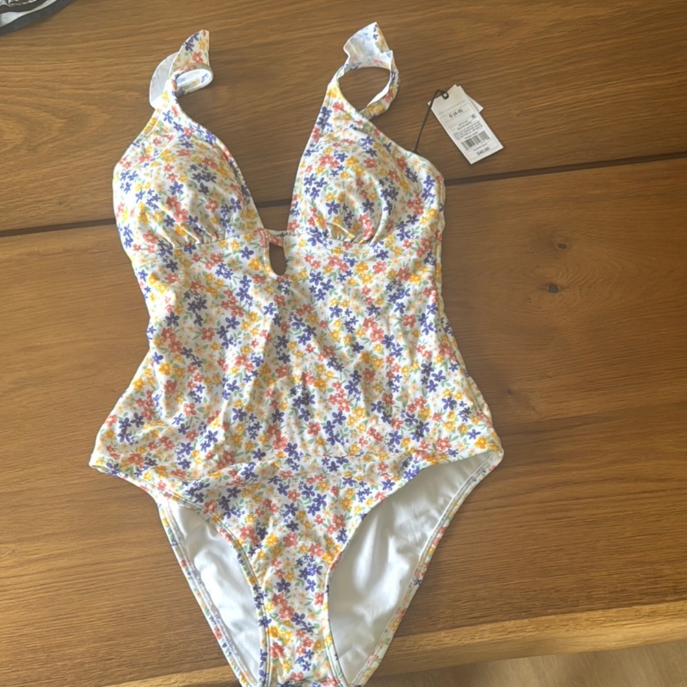 Floral women’s one piece 
shade and shore from target 
Never worn with tags